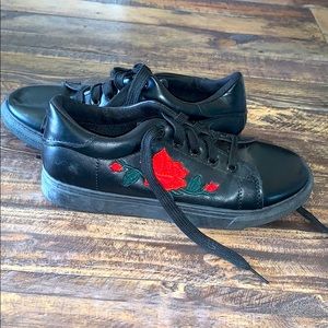 Black sneakers with a red rose on each shoe❕